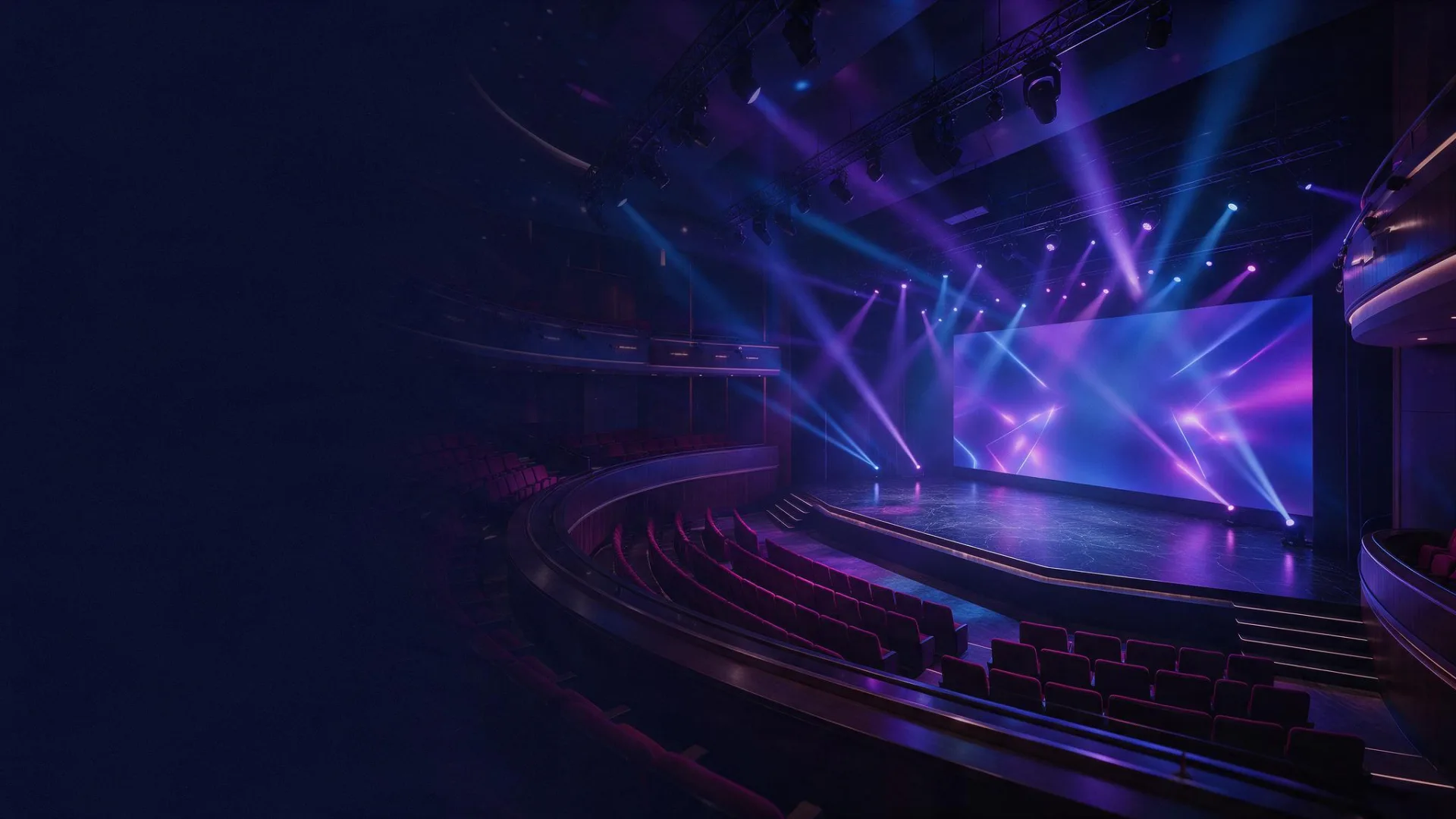 An auditorium lit for a conference before the audience arrives.